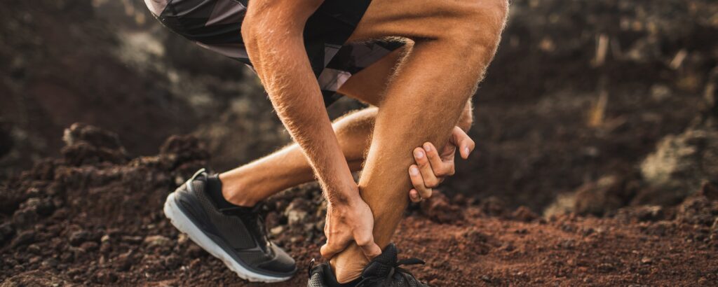 picture of a middle-aged male runner suffering from Achilles Tendinitis in Knoxville